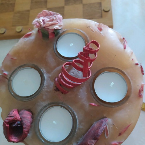 Decorative candle with dried flowers used