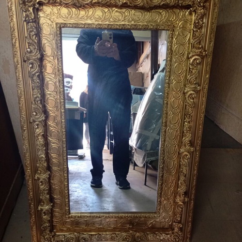 Vintage retro mirror with carved ornate gold frame used