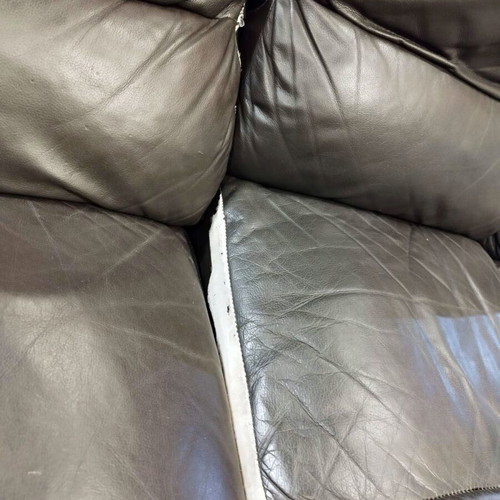 Three-seater black leather sofa with recline