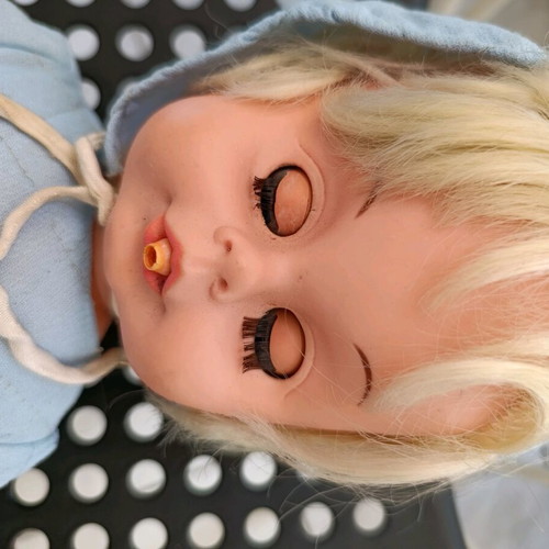 Vintage baby doll used with missing parts and wear