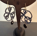 Earrings with blue laser cut leather flower design like new