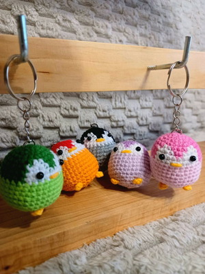 Knitted penguin keychains made to order
