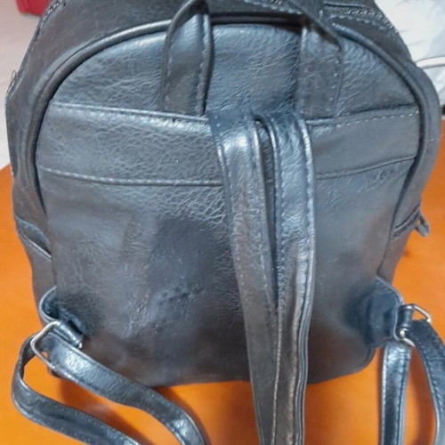 Backpack black medium made of eco leather with silver zippers like new