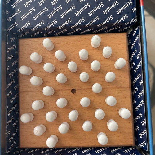 Solitaire game like new with wooden board and pegs in tin box