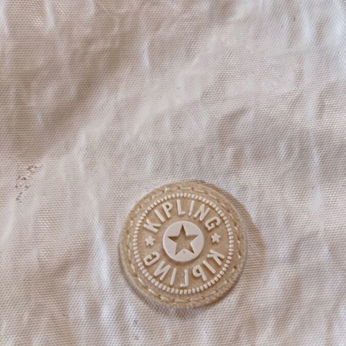 Kipling small crossbody bag used, beige with keychain