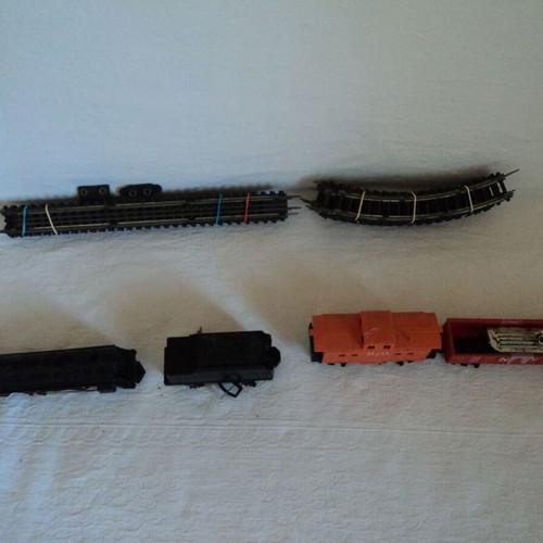 Train set used, engine with three wagons and tracks made in Japan