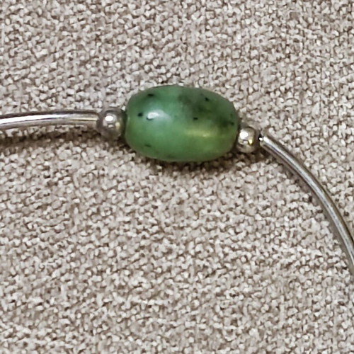 Minimal bracelet with green stones and silver details like new