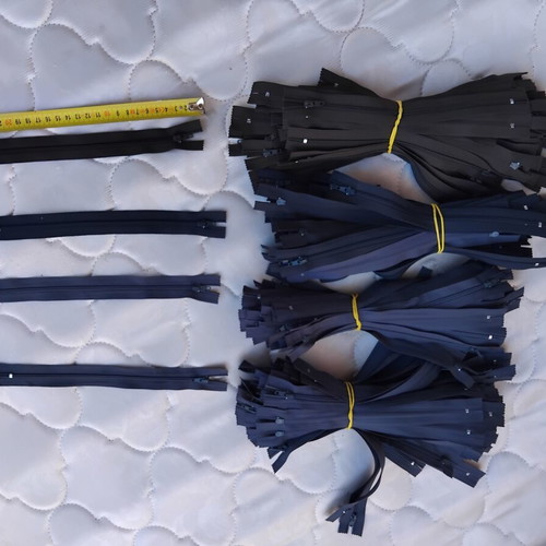 Metal and plastic sewing zippers YKK, assorted colors and sizes, pack