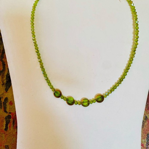 Handmade necklace new with green beads and four larger smooth beads