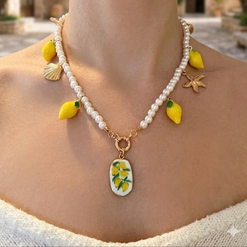 Necklace with faux pearls and charms, like new, white and yellow