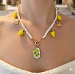 Necklace with faux pearls and charms, like new, white and yellow