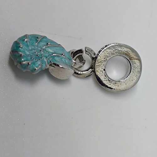 Silver charm with blue enamel Nautilus like new