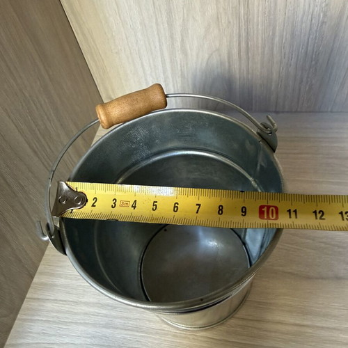 Decorative galvanized metal bucket with wooden handle