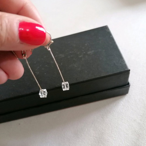 Silver earrings with crystal used