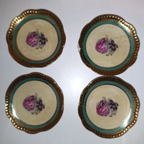 Vintage porcelain plates set of 4 with romantic design and gold trim used