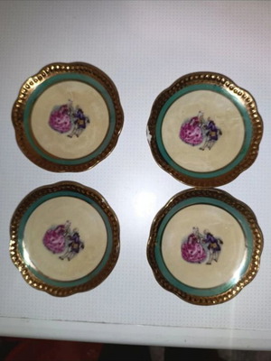 Vintage porcelain plates set of 4 with romantic design and gold trim used