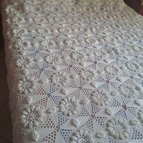 Handmade super double blanket with embossed designs and crocheted fringes