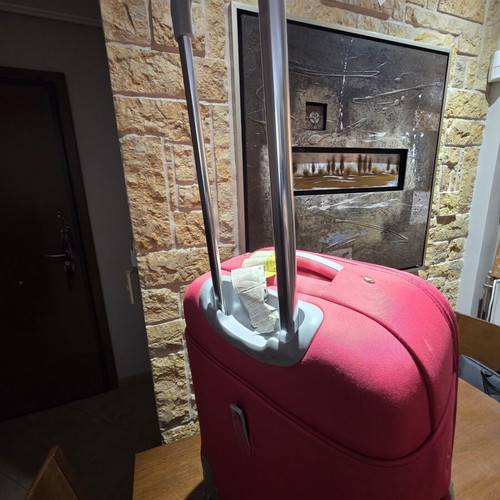 Carpisa 24" travel suitcase used, magenta color, semi-hard fabric