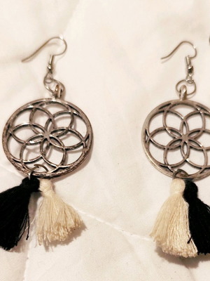 Earrings used with black and white tassels