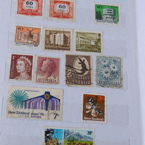 Red album with worldwide collectible stamps