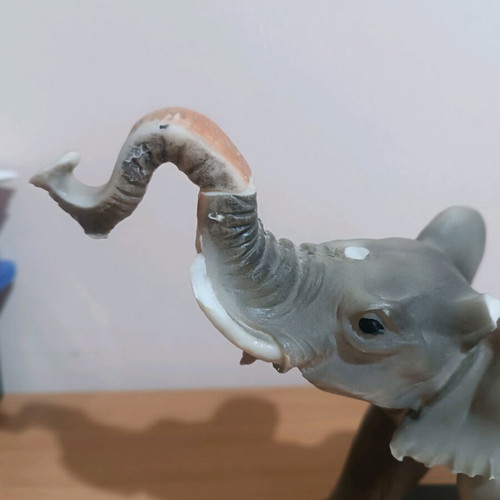 Vintage decorative elephant used with wooden base