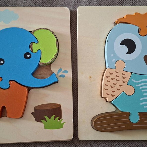 Wooden puzzles for children used, owl and elephant