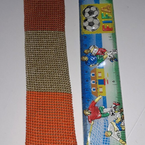Handmade bookmark with dark orange, light gold and dark red colors