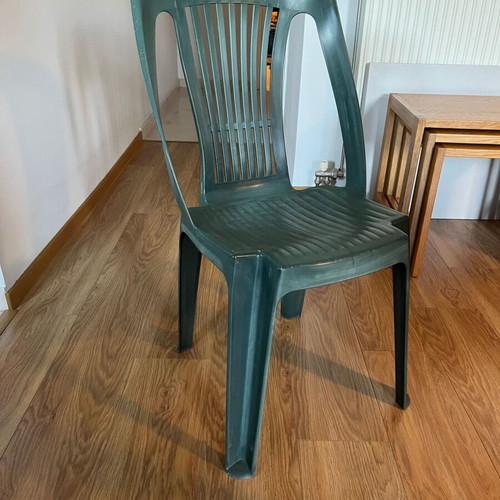 Set of 4 green plastic garden chairs