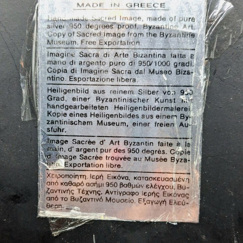 Silver embossed icon of Saint Nicholas used, with wooden base