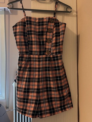 Checked one-piece shorts used, size XS, black and pink