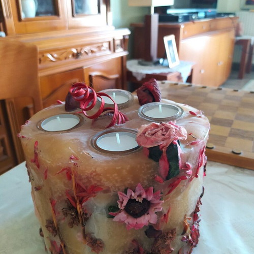 Decorative candle with dried flowers used