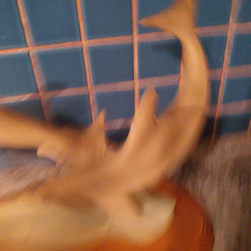 Vintage retro dolphin sculpture with wooden base used