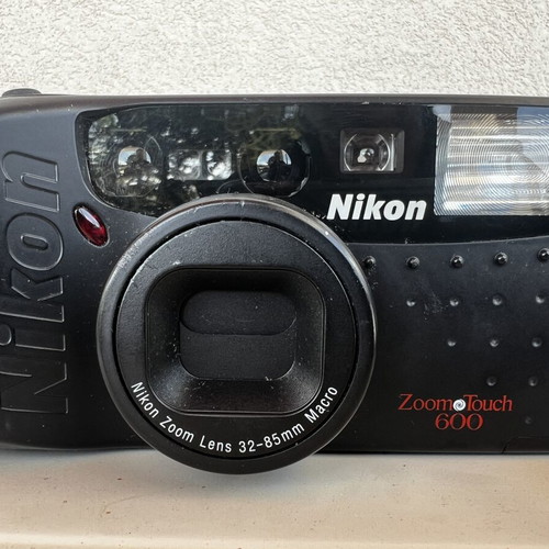 Olympus Super Zoom and Nikon Zoom Touch 600 cameras used