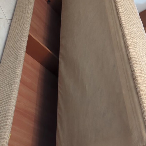 Practical three-seat sofa bed like new with storage compartments