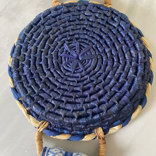 Blue handmade wicker basket with painted porcelain handles like new