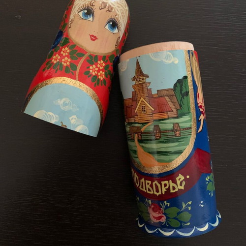 Old handmade wooden doll used with painted decoration