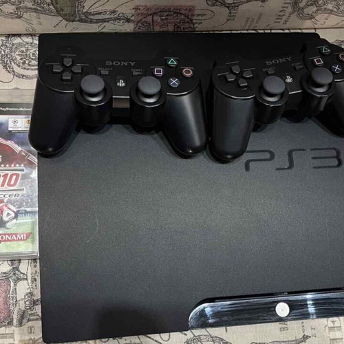 PlayStation 3 (PS3) like new with 2 games and 2 wireless controllers