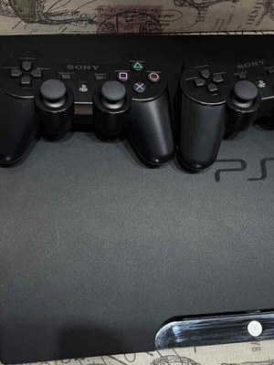 PlayStation 3 (PS3) like new with 2 games and 2 wireless controllers