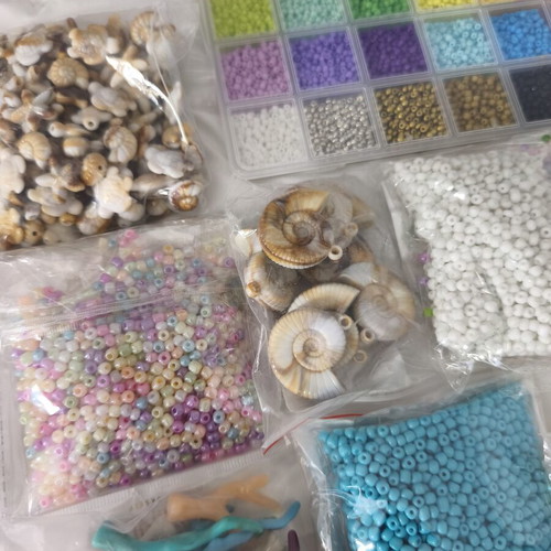 Jewelry making materials like new, shell chips, plastic and resin beads