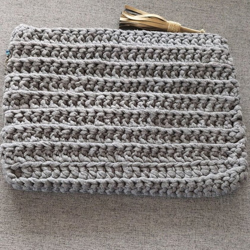 Handmade gray knitted bag new with embroidered border and tassel