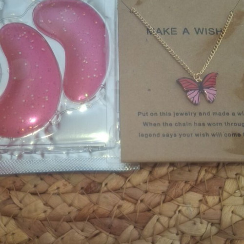 Butterfly necklace new with gold chain and pink eye patches