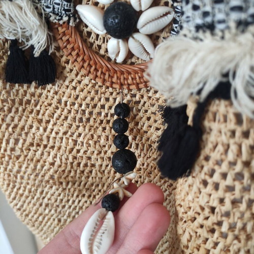 Boho straw backpack used with shells and rope straps, resort style