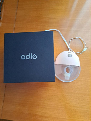Adlo portable breast pump like new with 2 flanges and unused spare part