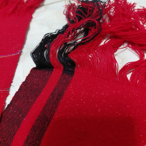 Traditional cotton fabric on loom, new, red with black stripes