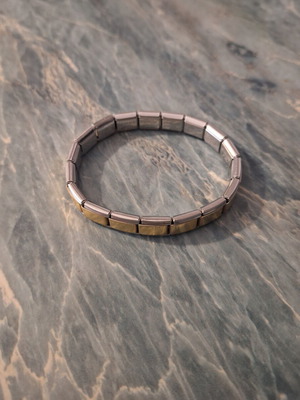 Unisex stainless steel elastic bracelet new with gold details