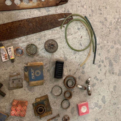 Various old chainsaw and small engine parts used