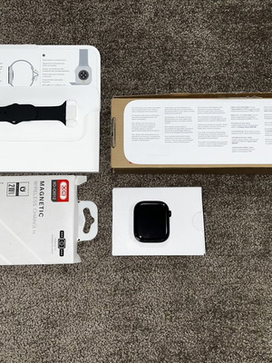 Apple Watch Series 11 46mm Demo Edition with compatible charger