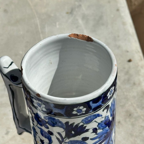 Vintage handmade ceramic cup and decorative Delft style jug used, blue floral