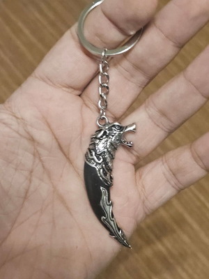 Keychain with wolf head tooth design, new, black