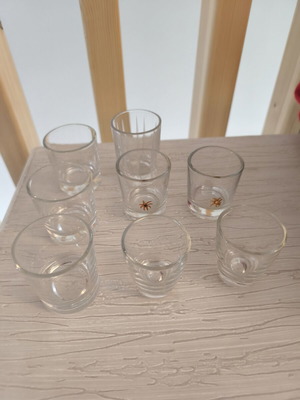 Shot glasses set of 8 with different designs like new